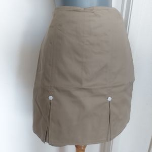 Girls uniform skort size 18, Khaki, with 2 flowers white design in front.  NWT.